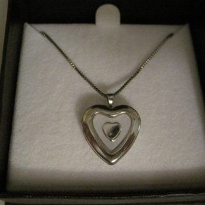 NIB Silver shaped locket